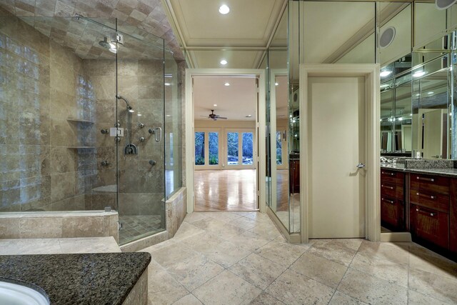 bathroom featuring vanity, an enclosed shower, ceiling fan, and hardwood / wood-style floors