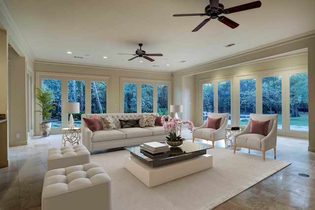 tiled living room featuring ornamental molding and ceiling fan