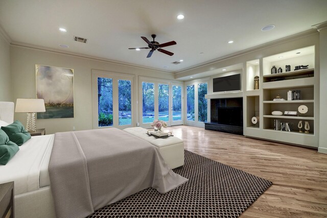 bedroom with crown molding, light hardwood / wood-style floors, access to outside, and ceiling fan