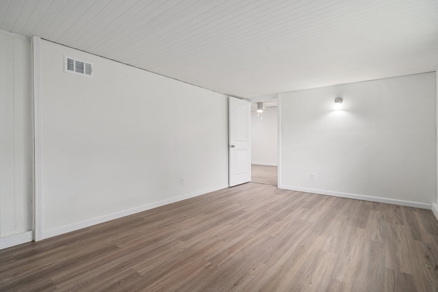 unfurnished room featuring hardwood / wood-style floors