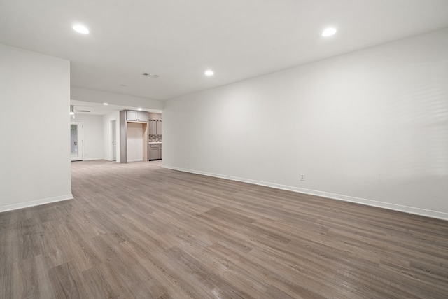 unfurnished living room with hardwood / wood-style floors