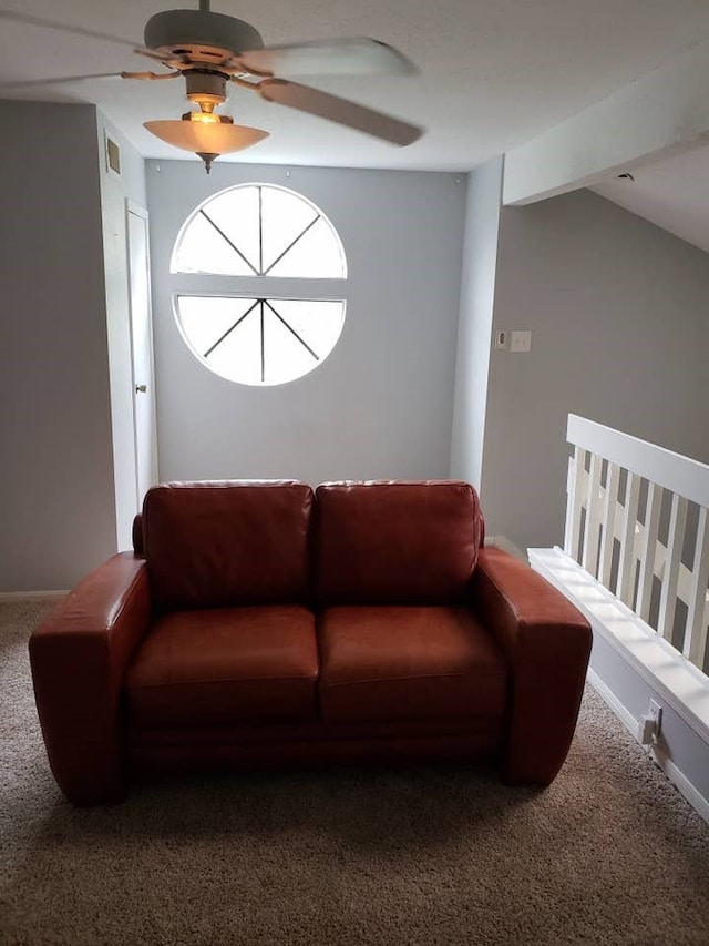 carpeted living room featuring ceiling fan