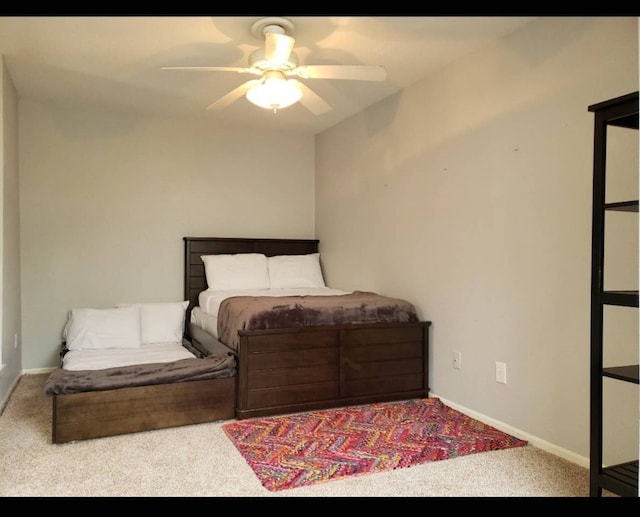 bedroom featuring ceiling fan and light colored carpet