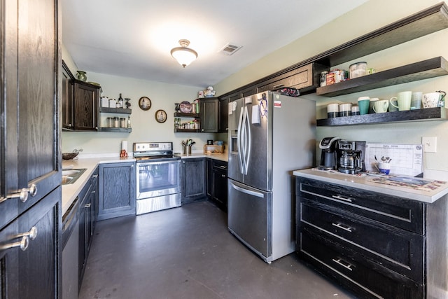 kitchen featuring visible vents, appliances with stainless steel finishes, light countertops, concrete floors, and open shelves