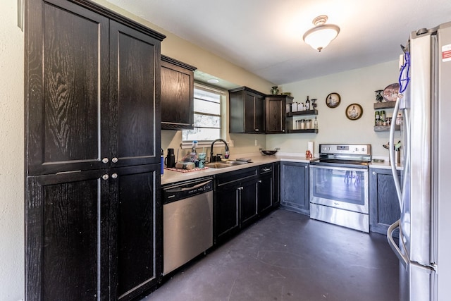 kitchen featuring appliances with stainless steel finishes, finished concrete floors, light countertops, open shelves, and a sink