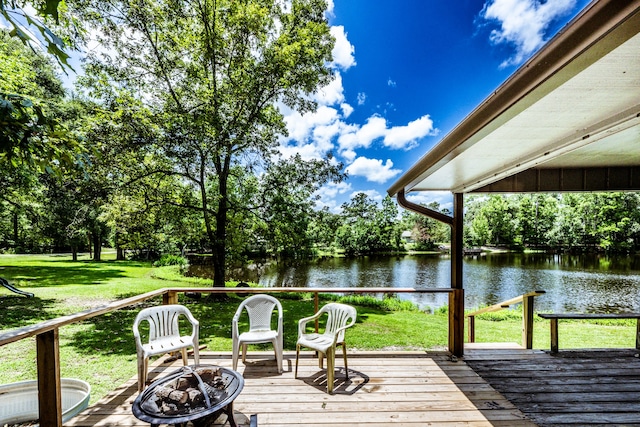 deck featuring a yard and a water view