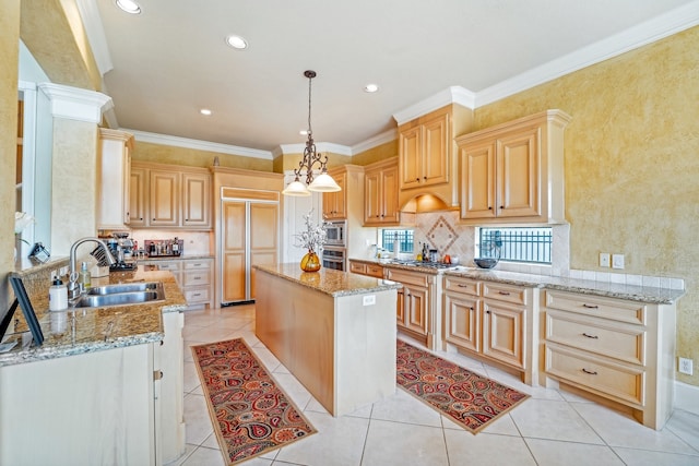 kitchen featuring a center island, light stone countertops, light brown cabinets, and light tile patterned floors