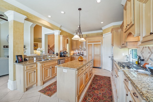 kitchen featuring light tile patterned flooring, a center island, light stone counters, and sink