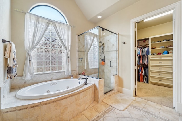 bathroom with independent shower and bath and tile patterned flooring