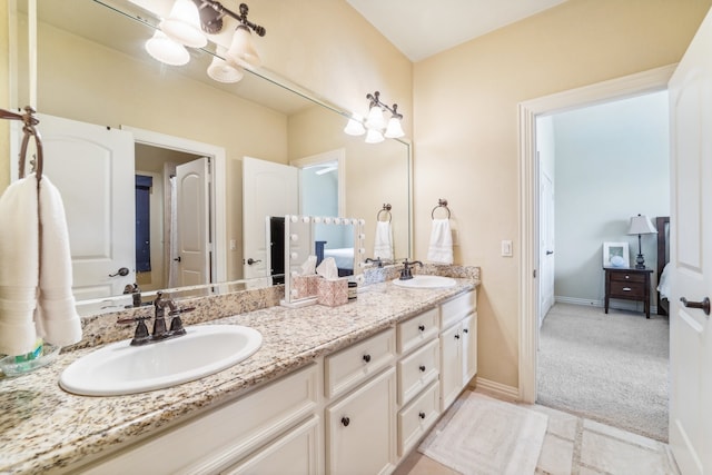 bathroom featuring dual vanity