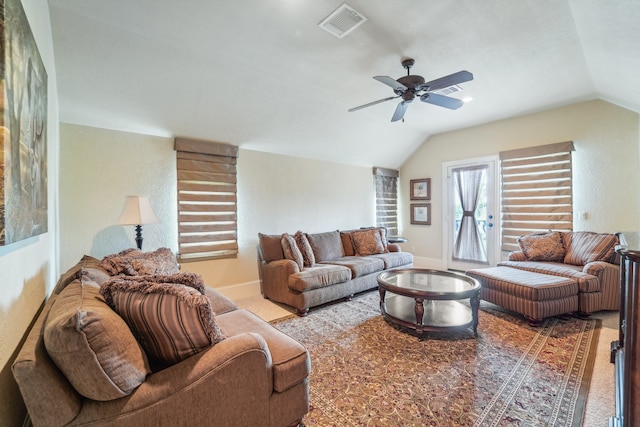 carpeted living room with lofted ceiling and ceiling fan