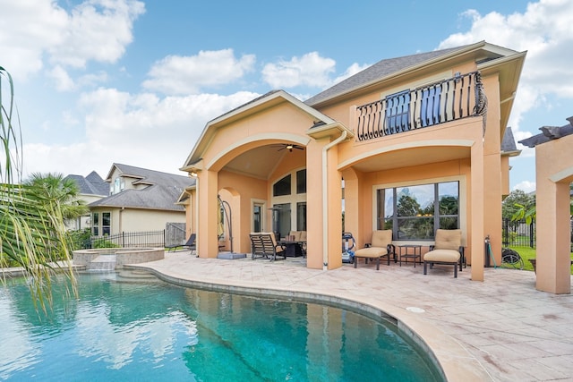 back of house with a patio, a balcony, and ceiling fan