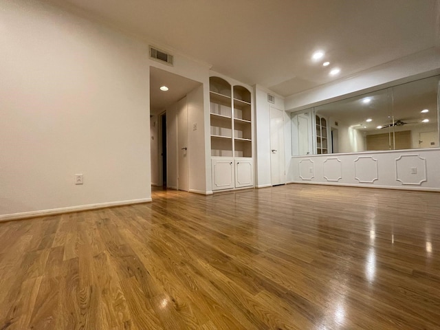 unfurnished living room featuring hardwood / wood-style floors