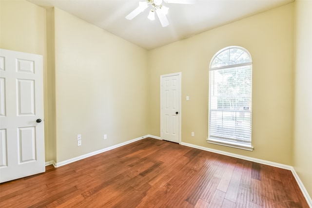 spare room with wood-type flooring and ceiling fan