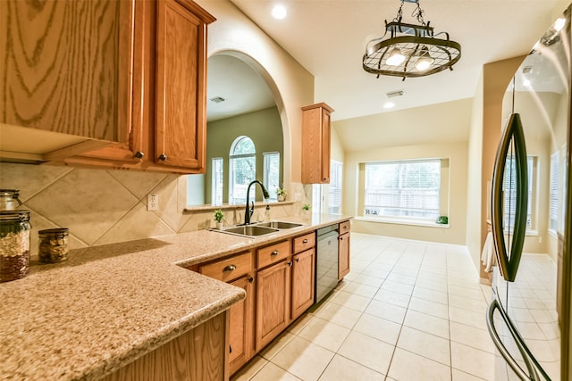 kitchen with tasteful backsplash, stainless steel appliances, light tile patterned floors, pendant lighting, and sink