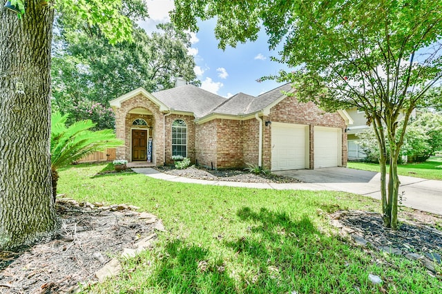 single story home with a garage and a front lawn