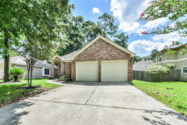 view of front of home featuring a garage and a front yard