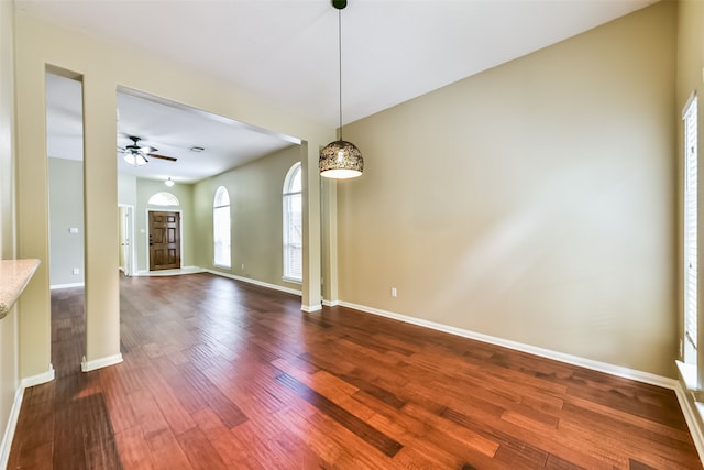 empty room featuring wood-type flooring and ceiling fan