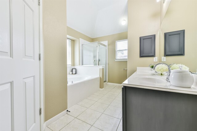 bathroom featuring vanity, tile patterned flooring, separate shower and tub, and vaulted ceiling