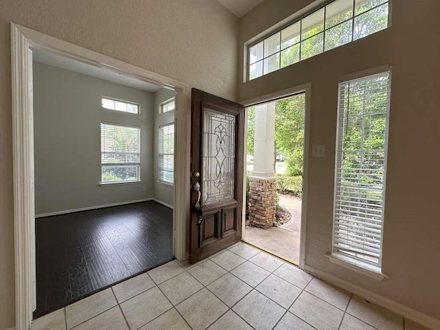 foyer entrance featuring light tile patterned flooring