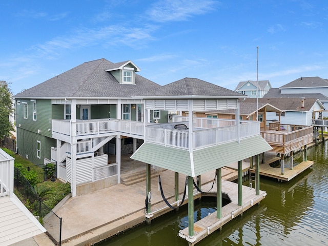 dock area featuring a deck with water view