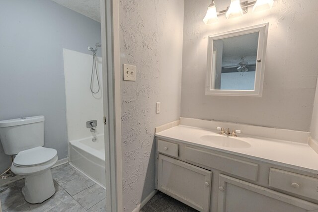 full bathroom with toilet, bathtub / shower combination, vanity, and a textured ceiling