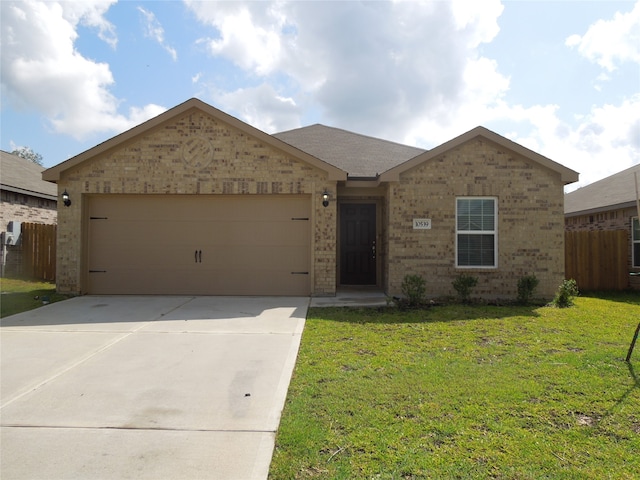 view of front of house with a garage and a front lawn