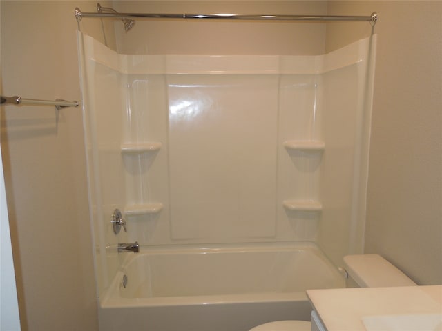 full bathroom with toilet, vanity, and tub / shower combination