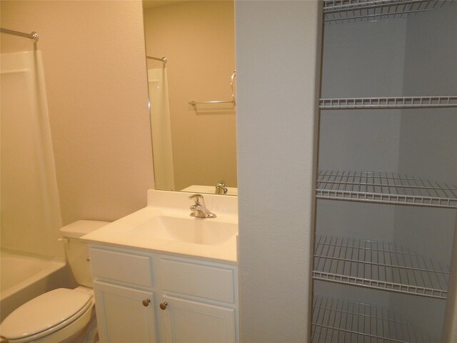 full bathroom featuring  shower combination, toilet, and vanity