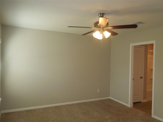 carpeted empty room with ceiling fan