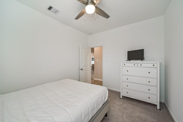 carpeted bedroom featuring ceiling fan