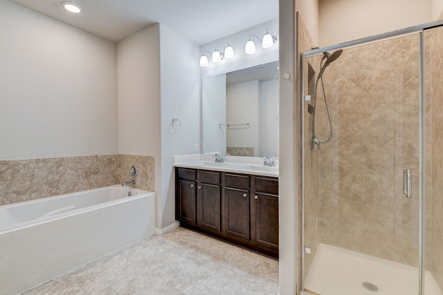 bathroom featuring vanity and separate shower and tub