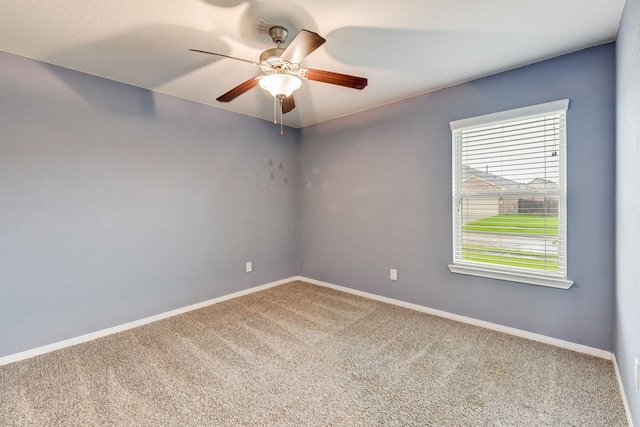 carpeted empty room with ceiling fan