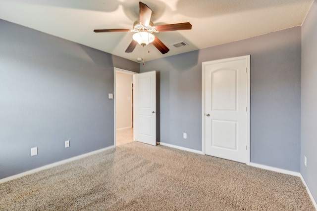 unfurnished bedroom with carpet flooring and ceiling fan