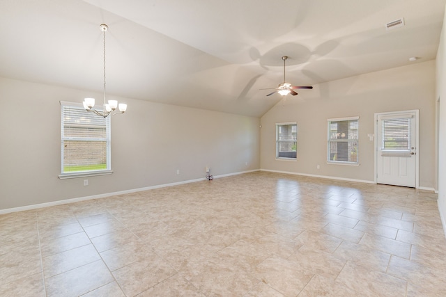 unfurnished room featuring vaulted ceiling and ceiling fan with notable chandelier