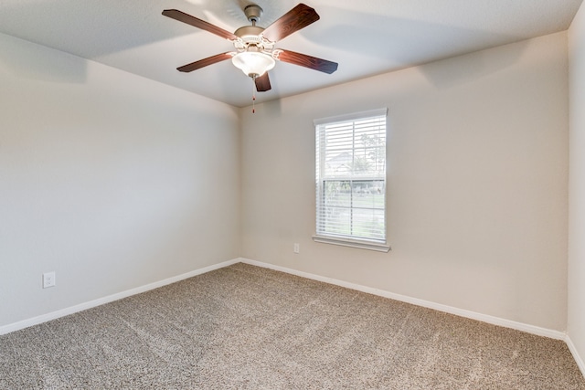 carpeted empty room with ceiling fan