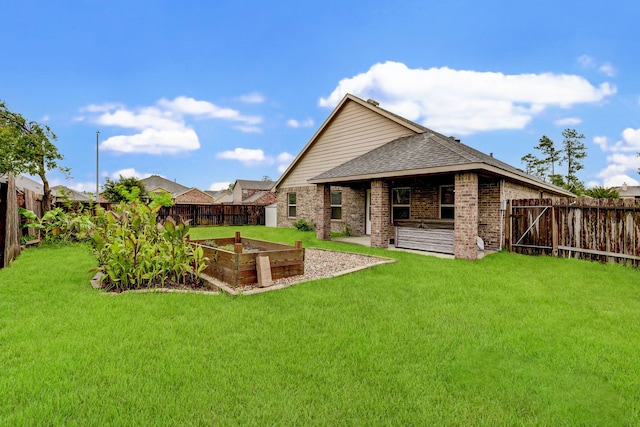 back of property featuring a lawn