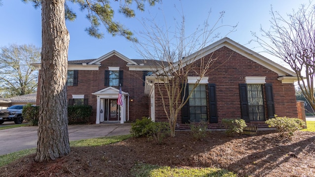 view of front of house with brick siding