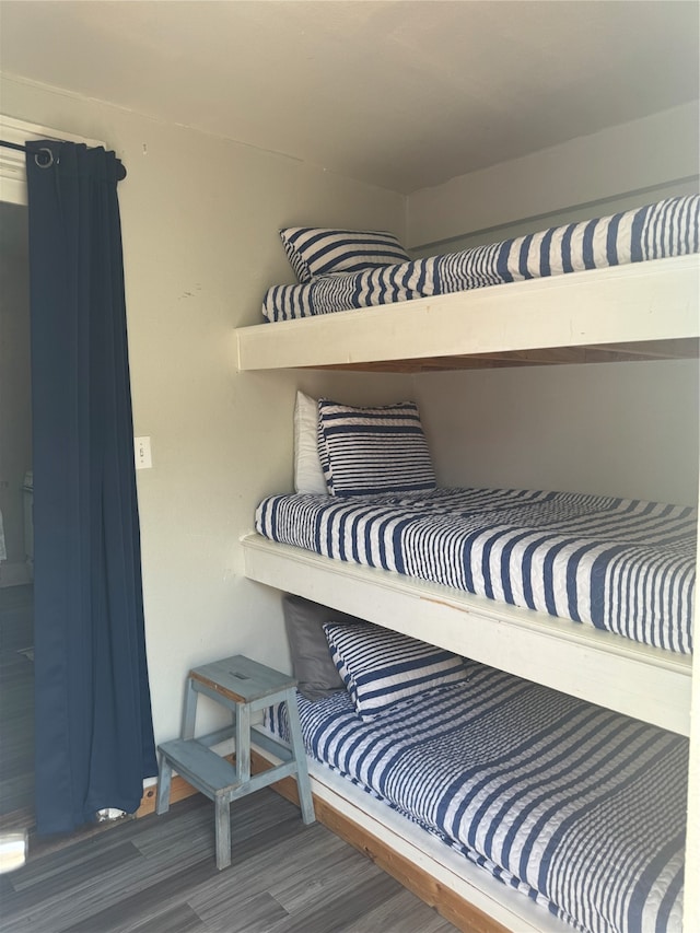 bedroom with hardwood / wood-style floors