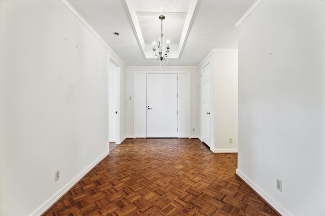 hall with an inviting chandelier, dark parquet flooring, and ornamental molding