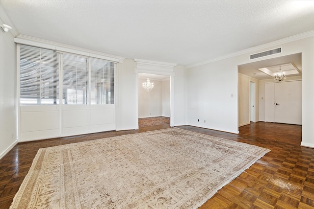 unfurnished living room with ornamental molding, a chandelier, and dark parquet floors