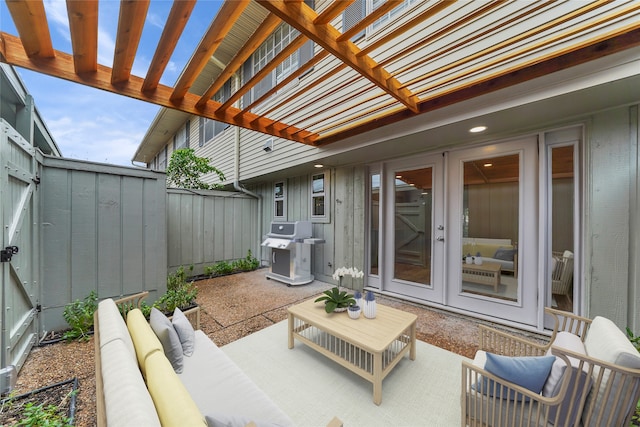 view of patio / terrace featuring area for grilling, an outdoor hangout area, and a pergola