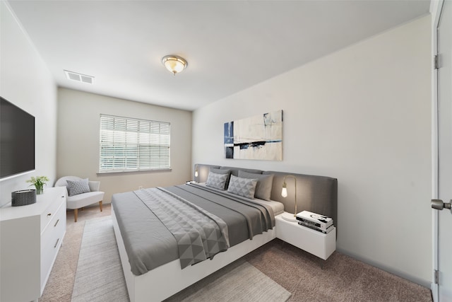 bedroom featuring light carpet