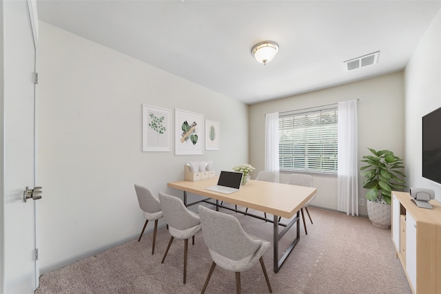 view of carpeted dining space