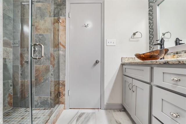 bathroom with vanity and an enclosed shower