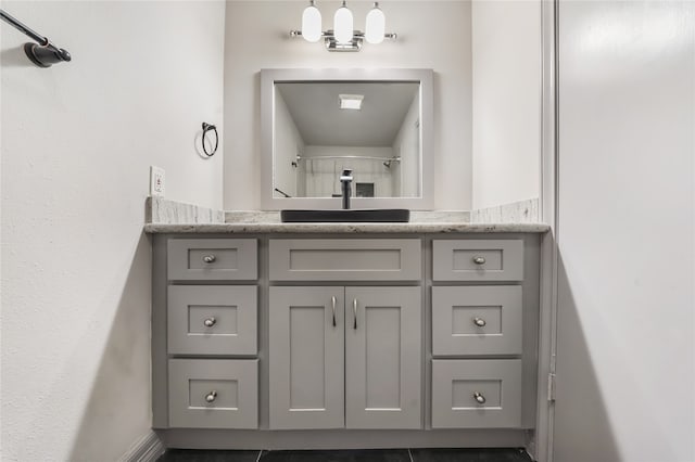 bathroom with vanity and tile patterned floors