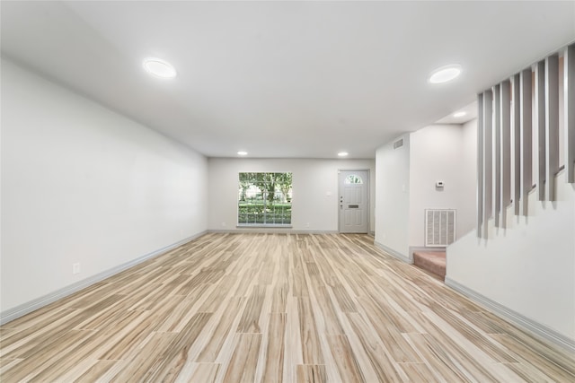 unfurnished room with light hardwood / wood-style flooring