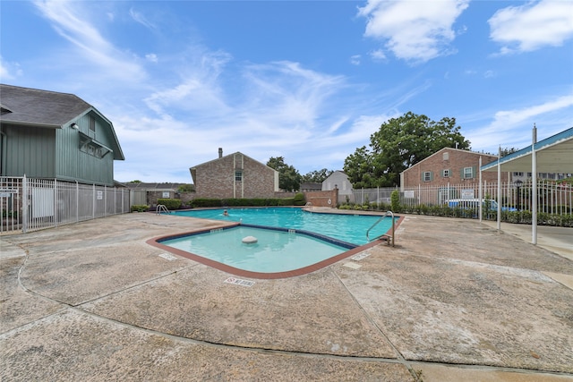 view of pool featuring a patio area