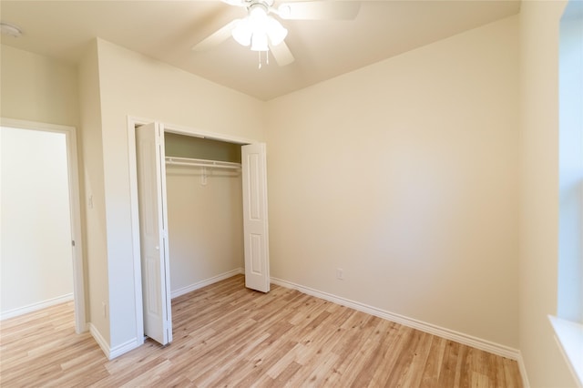 unfurnished bedroom with a closet, light wood-style flooring, and baseboards