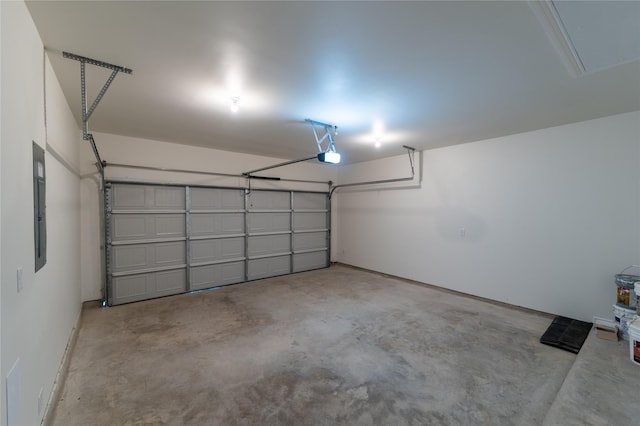 garage featuring electric panel and a garage door opener